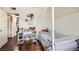 Bedroom features wood floors, white walls, and a bed with a canopy frame at 1607 Vegas Valley Dr, Las Vegas, NV 89169