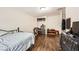 Bedroom features hardwood floors, closet shelving, and simple decor at 1607 Vegas Valley Dr, Las Vegas, NV 89169