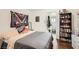 Bedroom features wood floors, neutral walls, and an open ensuite bathroom at 1607 Vegas Valley Dr, Las Vegas, NV 89169