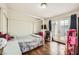 Bedroom with wood floors and access to the backyard through glass double doors at 1607 Vegas Valley Dr, Las Vegas, NV 89169