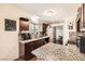 Kitchen features granite countertops, stainless steel appliances, and dark wood cabinets at 1607 Vegas Valley Dr, Las Vegas, NV 89169