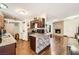Open kitchen featuring a tiled backsplash, stainless appliances and hardwood floors at 1607 Vegas Valley Dr, Las Vegas, NV 89169