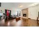 Cozy living room featuring a brick fireplace, hardwood floors and a leather sofa at 1607 Vegas Valley Dr, Las Vegas, NV 89169