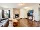 Bright living room with hardwood floors, stone fireplace and comfortable seating at 1607 Vegas Valley Dr, Las Vegas, NV 89169