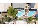 Overhead view of pools, backyard landscaping, patios and neighboring rooftops at 1906 Desert Sage Ave, North Las Vegas, NV 89031