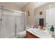 Well-maintained bathroom with a walk-in shower, vanity, and neutral decor at 1906 Desert Sage Ave, North Las Vegas, NV 89031
