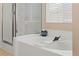 Relaxing bathroom features a soaking tub and a separate shower stall at 1906 Desert Sage Ave, North Las Vegas, NV 89031