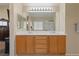 Bright bathroom with double sinks, vanity, and a large mirror at 1906 Desert Sage Ave, North Las Vegas, NV 89031