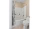 A clean and modern bathroom showcases a tub-shower combo and a standard toilet at 1906 Desert Sage Ave, North Las Vegas, NV 89031