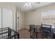 Cozy bedroom features a closet, window with blinds, neutral walls, and carpeted floors at 1906 Desert Sage Ave, North Las Vegas, NV 89031