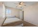 Small, carpeted bedroom with natural light at 1906 Desert Sage Ave, North Las Vegas, NV 89031