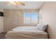 Carpeted bedroom with view of exterior at 1906 Desert Sage Ave, North Las Vegas, NV 89031