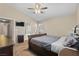 Bedroom with a ceiling fan and doorway view to the bathroom at 1906 Desert Sage Ave, North Las Vegas, NV 89031
