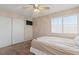 Carpeted bedroom with closet, ceiling fan and window at 1906 Desert Sage Ave, North Las Vegas, NV 89031