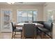 Dining area features a door to the patio, and a large window at 1906 Desert Sage Ave, North Las Vegas, NV 89031