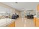 Bright dining area with natural light, tiled floor, granite countertops, and access to the kitchen at 1906 Desert Sage Ave, North Las Vegas, NV 89031