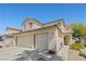 Charming two-story home with a three-car garage and covered front porch in a well-kept neighborhood at 1906 Desert Sage Ave, North Las Vegas, NV 89031