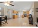 Open-concept kitchen and dining area with tile floors and stainless steel appliances at 1906 Desert Sage Ave, North Las Vegas, NV 89031