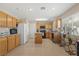 Spacious kitchen with granite countertops, stainless steel appliances, and tile flooring at 1906 Desert Sage Ave, North Las Vegas, NV 89031