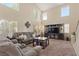 Bright and spacious living room with high ceilings, plush seating and a modern entertainment center at 1906 Desert Sage Ave, North Las Vegas, NV 89031