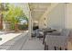 Relaxing outdoor patio with comfortable seating, pergola, and serene backyard views at 1906 Desert Sage Ave, North Las Vegas, NV 89031