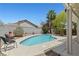 Inviting backyard pool with beautiful landscaping and patio area perfect for relaxation and entertaining at 1906 Desert Sage Ave, North Las Vegas, NV 89031