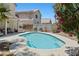 An in-ground swimming pool is surrounded by seating and landscaping at 1906 Desert Sage Ave, North Las Vegas, NV 89031