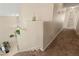 Carpeted stairway with white walls, leading to a bright hallway at 1906 Desert Sage Ave, North Las Vegas, NV 89031