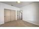 Neutral carpeted bedroom with closet and a window to provide natural light at 2117 Desert Peak Rd, Las Vegas, NV 89134