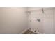 Clean laundry room with wood-look tile floor and wire shelving for storage at 2117 Desert Peak Rd, Las Vegas, NV 89134