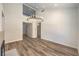 Spacious living area featuring wood floors and a modern chandelier at 2117 Desert Peak Rd, Las Vegas, NV 89134