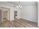 Spacious main bedroom with wood-look flooring and an attached bathroom with a glass shower at 2117 Desert Peak Rd, Las Vegas, NV 89134