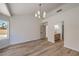 Light-filled main bedroom with wood floors and an ensuite bathroom at 2117 Desert Peak Rd, Las Vegas, NV 89134