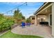 Spacious backyard with paver patio, decorative landscaping, and string lights for relaxed outdoor living at 2433 Amatrice St, Henderson, NV 89044