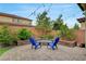 This backyard features a paver patio with string lights and custom hardscape for a modern outdoor living at 2433 Amatrice St, Henderson, NV 89044
