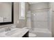 Stylish bathroom featuring a shower-over-tub setup, attractive fixtures, and shuttered window at 2433 Amatrice St, Henderson, NV 89044