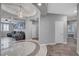 Elegant foyer with tiled flooring, leading to a living room with a comfortable gray couch at 2433 Amatrice St, Henderson, NV 89044