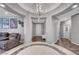 Inviting foyer with designer tile accents, high ceilings, and arched entryways to adjacent living spaces at 2433 Amatrice St, Henderson, NV 89044