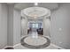 Elegant foyer with decorative tile inlay that leads to the open floorplan featuring a living area at 2433 Amatrice St, Henderson, NV 89044