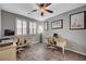 Dedicated home office features two desks, neutral colors, and large windows with plantation shutters at 2433 Amatrice St, Henderson, NV 89044