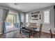Bright kitchen and dining area features a dining table set, patio access and decor at 2433 Amatrice St, Henderson, NV 89044