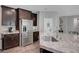 The kitchen features granite countertops and a stainless steel refrigerator at 2433 Amatrice St, Henderson, NV 89044