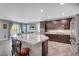 Kitchen with a large island, granite countertops and stainless steel appliances at 2433 Amatrice St, Henderson, NV 89044