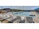 Community lap pool featuring blue water, lane dividers, and lounge chairs with well-manicured landscaping at 2433 Amatrice St, Henderson, NV 89044