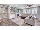 Cozy living room with built-in shelving, fireplace, comfortable seating, and ample natural light at 2433 Amatrice St, Henderson, NV 89044