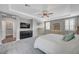 Comfortable main bedroom with ceiling fan, plush carpet, ensuite access, and ample natural light at 2433 Amatrice St, Henderson, NV 89044