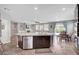 Bright, open floor plan showcases the kitchen island, living room, and dining area at 2433 Amatrice St, Henderson, NV 89044