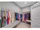 Spacious walk-in closet featuring ample hanging space for clothes and shelves for shoes and accessories at 2433 Amatrice St, Henderson, NV 89044