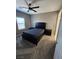 Bedroom featuring a ceiling fan, carpet floors, and a large bed set at 289 Aravalli Crest St, Henderson, NV 89015