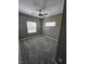 Carpeted bedroom featuring a ceiling fan and natural light at 289 Aravalli Crest St, Henderson, NV 89015